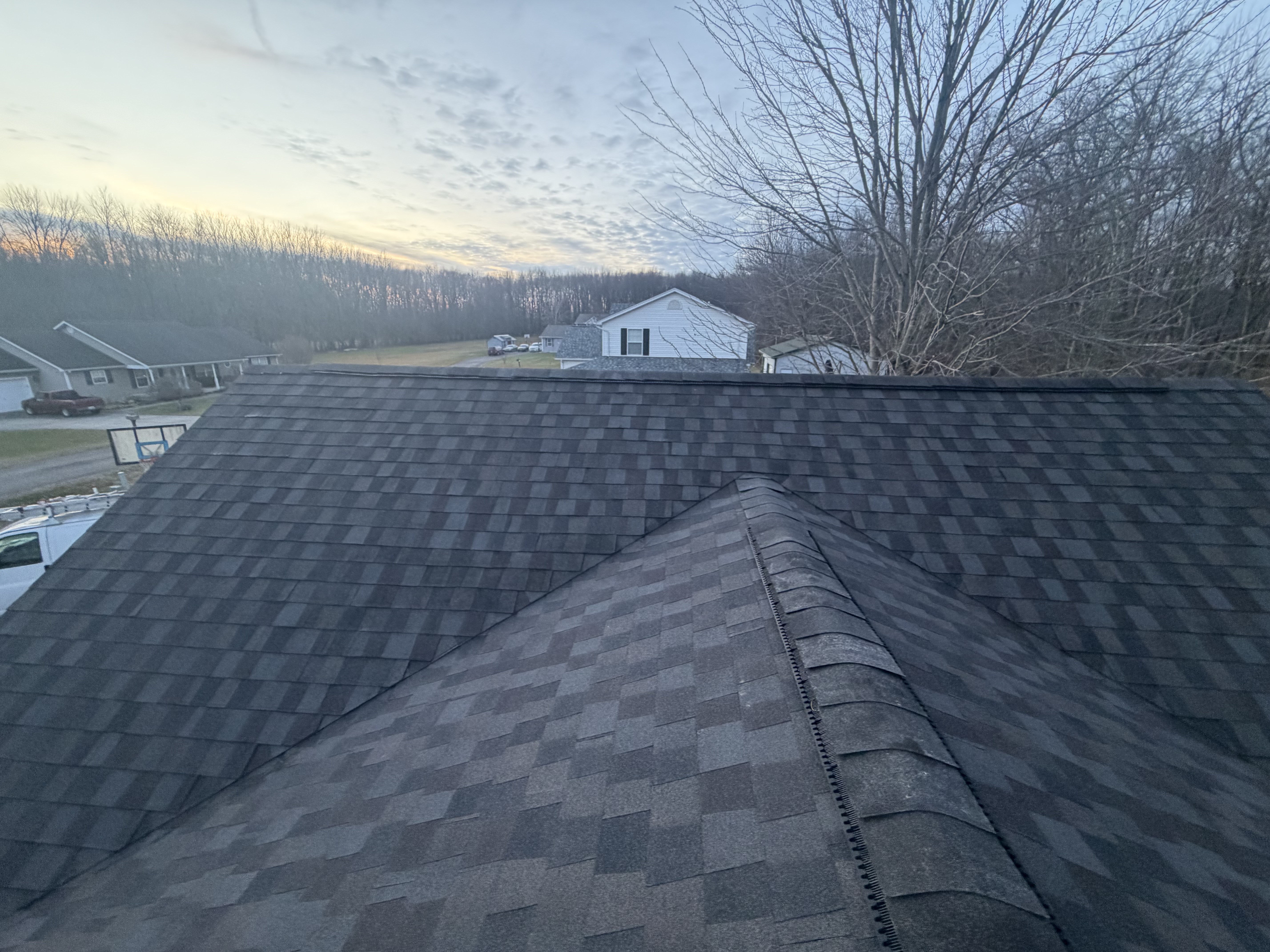 Fresh shingles from ridge to eave by Resolute Construction and Remodel