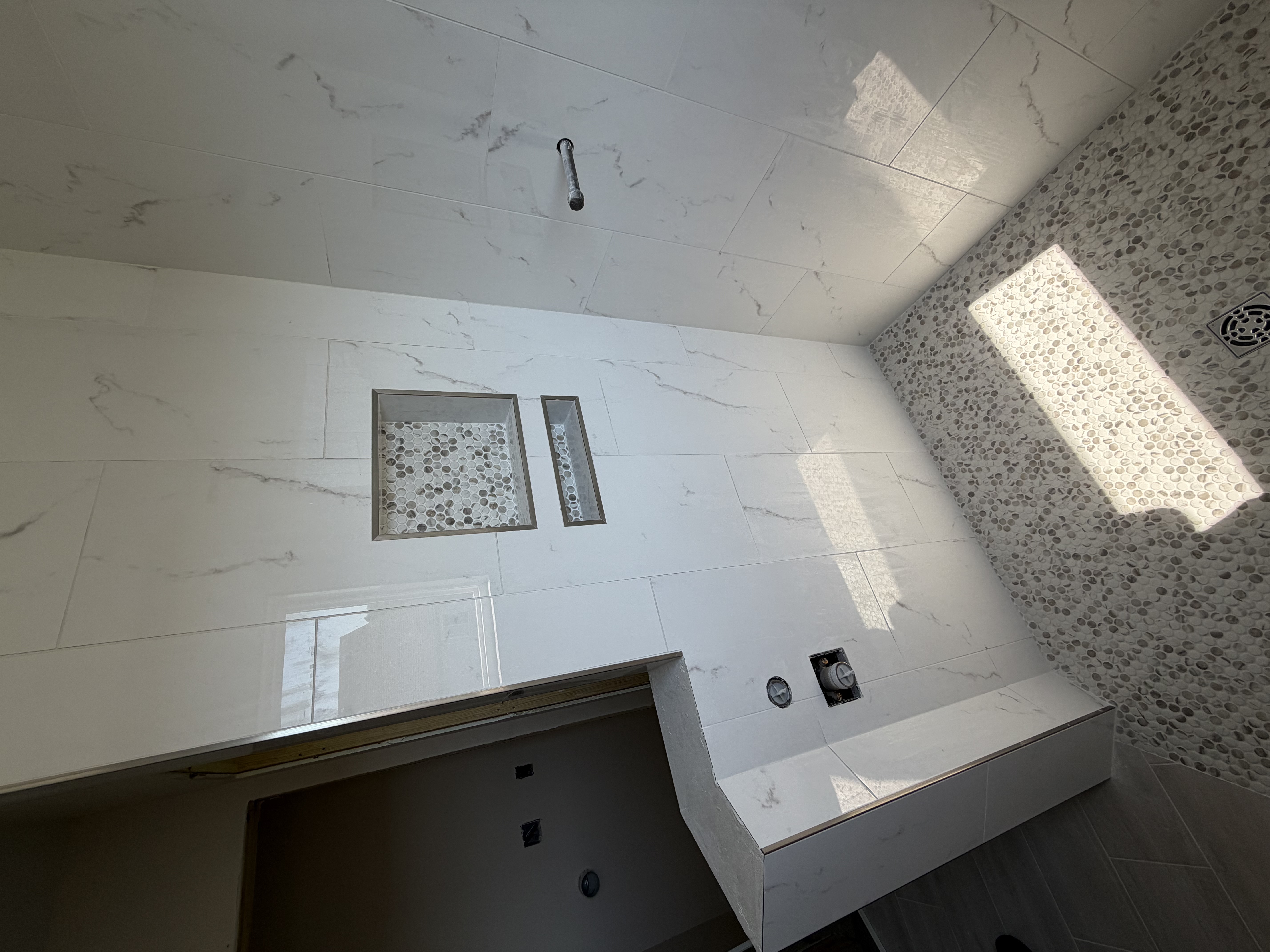 Custom recessed shower niches by Resolute Construction and Remodel