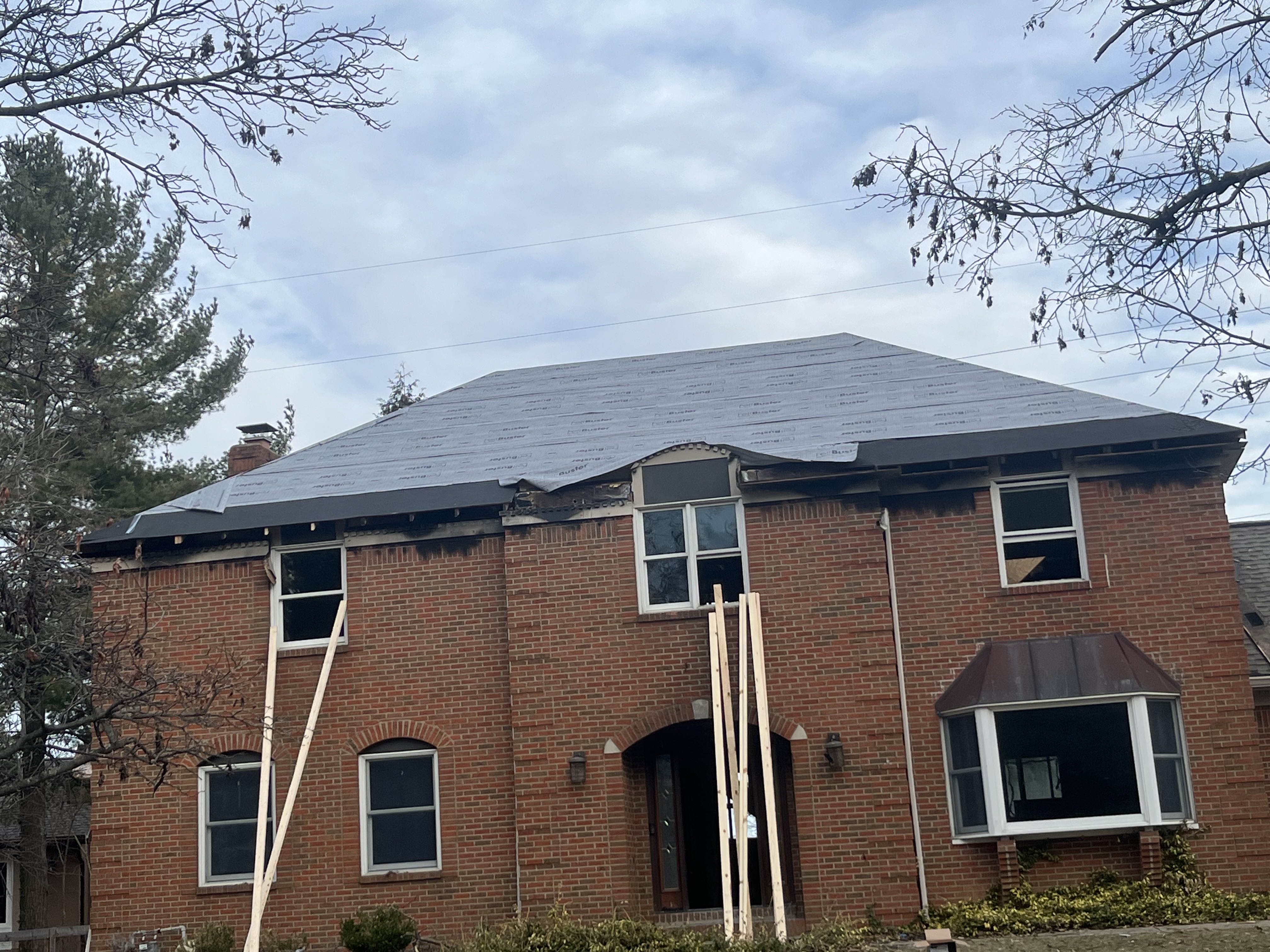 Fire and storm damage before restoration by Resolute Construction and Remodel