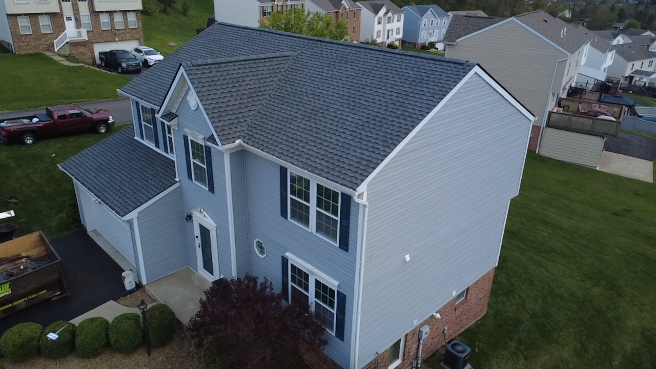 New architectural shingle roof by Resolute Construction and Remodel